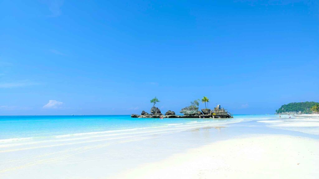White sand and turquoise water along a beach in Boracay