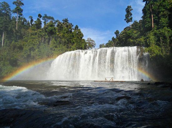 Wide Tinuy-an Falls cascading into a river amid forest in Surigao del Sur